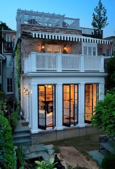 an exterior view of a house with lots of windows