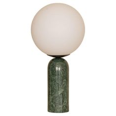 a green marbled table lamp with a white ball on it's top and base