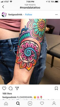 a person with a colorful tattoo on their arm