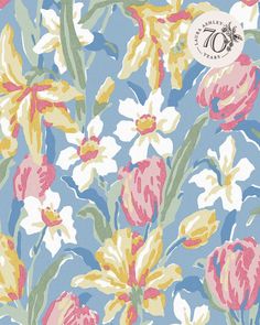 a blue and yellow floral wallpaper with white, pink, and green flowers on it