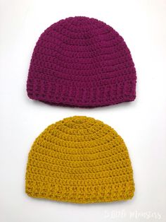 two crocheted hats sitting next to each other