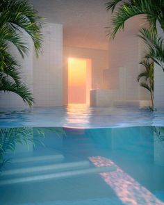 an indoor swimming pool with palm trees and sun reflecting off the water's surface