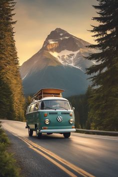 an old vw bus driving down the road with mountains in the backgroud