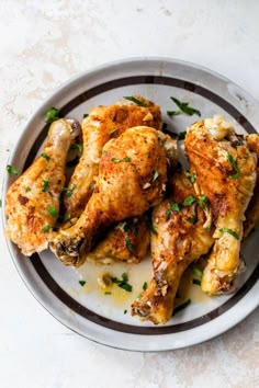 a plate with some chicken wings on it