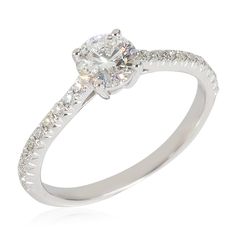 a diamond engagement ring on a white background