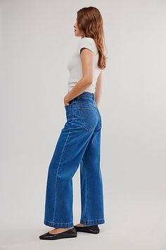 High-waisted jeans featured in a wide-leg silhouette. * Authentic denim * Front and back patch pockets * Button closure and zip fly | Rolla’s Sailor Jeans by Rolla's at Free People in Medium Wash, Size: 32 Versatile High Rise Denim Wide Leg Pants, Classic Jeans With Pockets For Rodeo, Versatile Wide-leg Jeans With Pockets, Rollas Sailor Jean, Sailor Jeans, Wide-leg Rigid Denim Bottoms With Belt Loops, Sailor Jean, Blue Fits, Back Patch