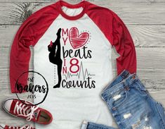 a red and white baseball shirt with the words my heart beats no counts on it