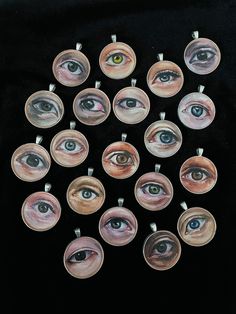 twelve eye glass cabochles on black background