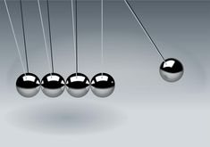 an image of newton pendulums with balls on them hanging from the ropes in order to balance