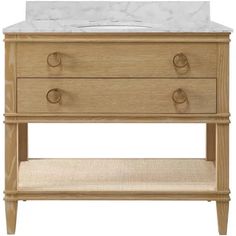 a bathroom vanity with marble top and drawers on the bottom, along with a white sink