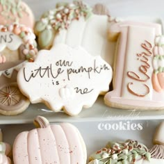 cookies decorated with different designs and words on top of each other, including pumpkins