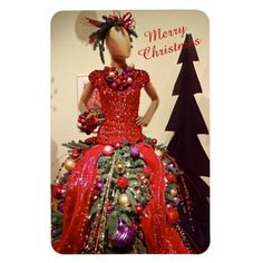 a mannequin dressed in red and green christmas decorations