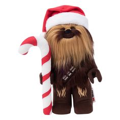 a star wars chew toy with a santa hat and candy cane in it's mouth