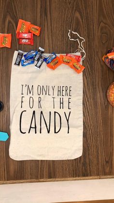 i'm only here for the candy tote bag on a table with candy and candies