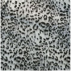 an animal print fabric with black and white spots