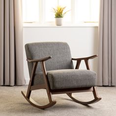 a rocking chair in front of a window