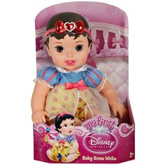 a toy doll with a red bow on it's head in a packaging box