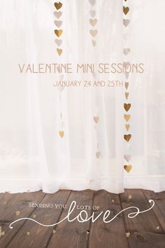 a poster for valentine's day with gold hearts hanging from the ceiling and white sheer curtains