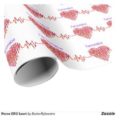 a white wrapping paper with red and pink heartbeats printed on it, next to a roll of tape