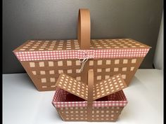 an open box sitting on top of a white table next to a gray and brown wall