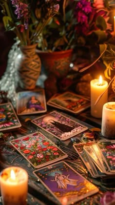 a table topped with lots of cards and candles