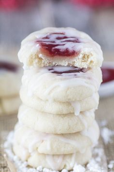 glazed strawberry thumbprint cookies stacked on top of each other with text overlay