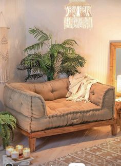 a living room filled with furniture and candles