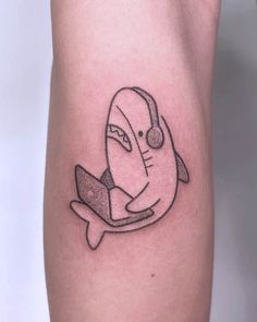 The online surfing shark tattoo by @pigeonpokes Small Tattoos Shark, Cute Simple Shark Tattoo, Shark Tiny Tattoo, Aesthetic Shark Tattoo, Shark Tattoo Cute, Funny Shark Tattoo, Funny Animal Tattoos, Cartoon Shark Tattoo, Silly Shark Tattoo