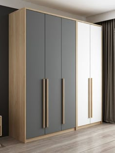 a large gray and white cabinet in a room with wood flooring on the side