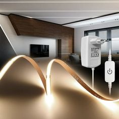 an image of a modern living room setting with lighting and cords on the wall in front of it