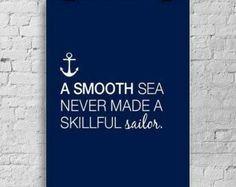 a smooth sea never made a skillful sailor poster on a white brick wall with an anchor