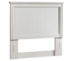 a white headboard with wooden slats on the top and bottom panel, in front of a white background