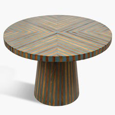 a round wooden table with an unusual design on it's top and bottom, made out of multicolored wood