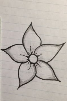 a drawing of a flower on lined paper