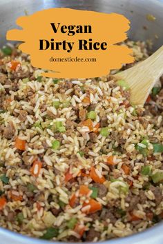 a bowl filled with brown rice and vegetables next to a wooden spoon in the bowl