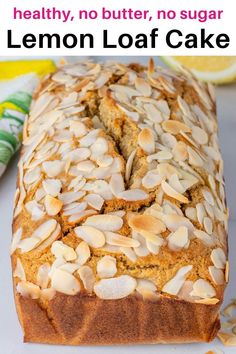 a loaf of lemon loaf cake with almonds on top