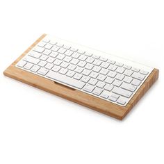 a wooden keyboard and mouse pad on a white background