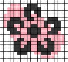 a cross stitch pattern with pink and black hearts on it's face, in the middle