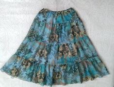 80s-90s summer skirt, ruffled blue skirt, 10 size, floral bohemian skirt, ribbed fabric, boho maxi botanical skirt, gathered gipsy pop-art skirt. vintage items always show signs of being worn please check the measurements before ordering Measurements laying flat : waist (elasticated) :33 cm - 41cm (13 inches - 16 inches) hips :58 cm (23 inches) total lenght:90 cm (35 inches) Blue Floral Print Tiered Maxi Skirt, Hippie Floral Print Tiered Skirt, Hippie Tiered Floral Print Skirt, Hippie Tiered Skirt With Floral Print, Spring Hippie Maxi Skirt With Ruffles, Hippie Floral Print Flowy Skirt, Vintage Flowy Ruffled Maxi Skirt, Vintage Tiered Skirt For The Beach, Hippie Blue Skirt For Spring