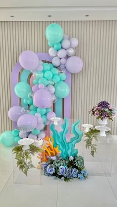 an under the sea themed party with balloons and flowers