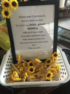 sunflowers in a basket with a sign on it