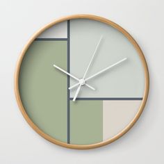 a clock that is on the wall with some sort of color block pattern in it