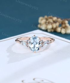 an oval cut blue topazte and diamond engagement ring