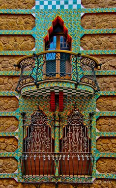 an ornate balcony and balconies on the side of a building in barcelona, spain