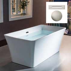 a bathtub sitting on top of a tiled floor next to a window with city lights in the background