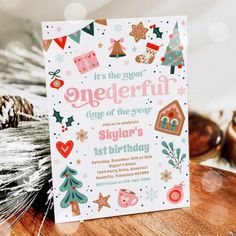 there is a birthday card on top of a table with pine cones and other decorations