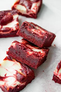 red velvet brownies with white frosting on top