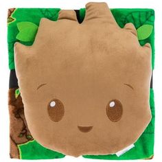 a stuffed animal with leaves on it's back