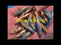 there are many different colored beads in the palm of someone's hand that says happy claying