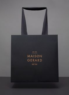 a black shopping bag with the words maison gerard on it's front and side